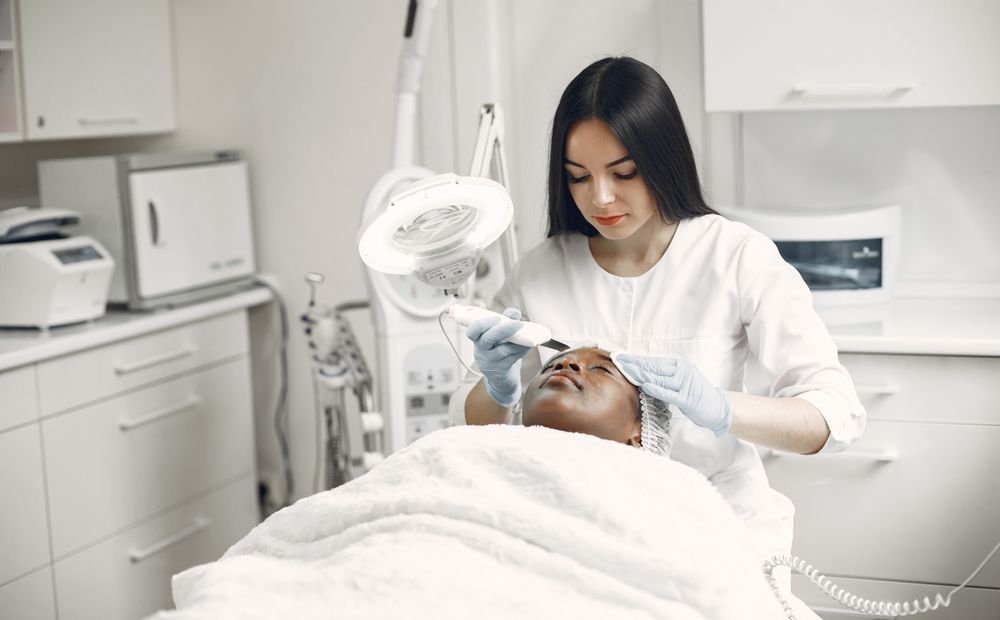 Esthetician performing a facial treatment, the kind of service photo a treatment landing page should feature Esthetician performing a facial treatment, the kind of service photo a treatment landing page should feature