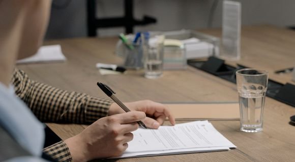 Office desk with paperwork representing inconsistent business listing records