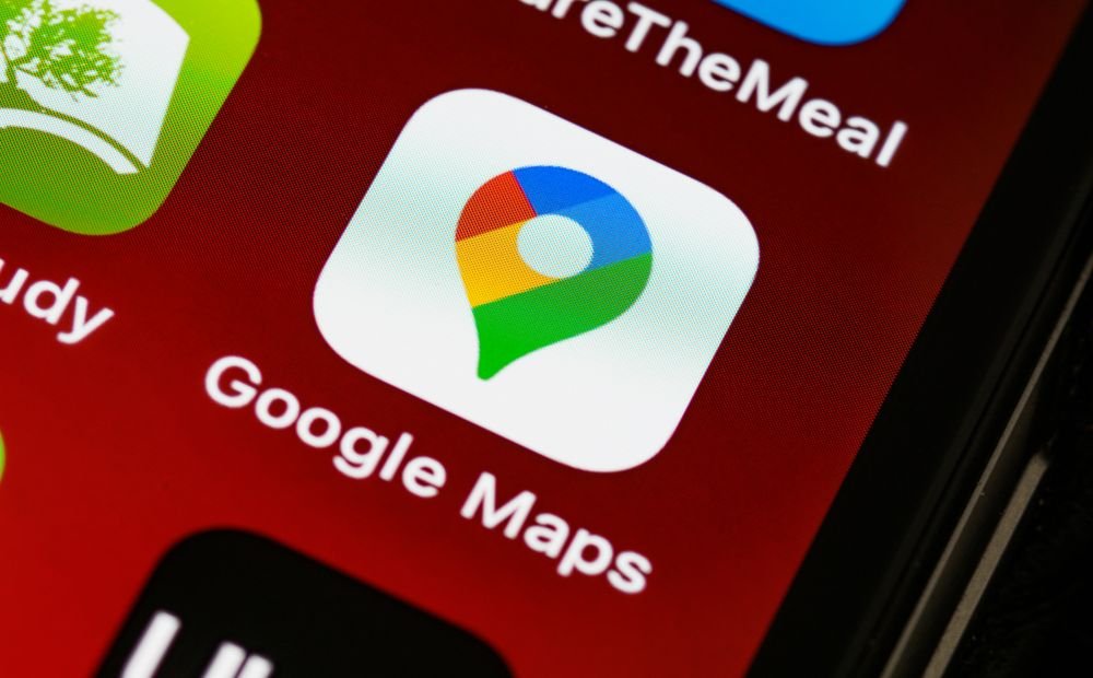 Person checking a business listing on Google Maps from a smartphone