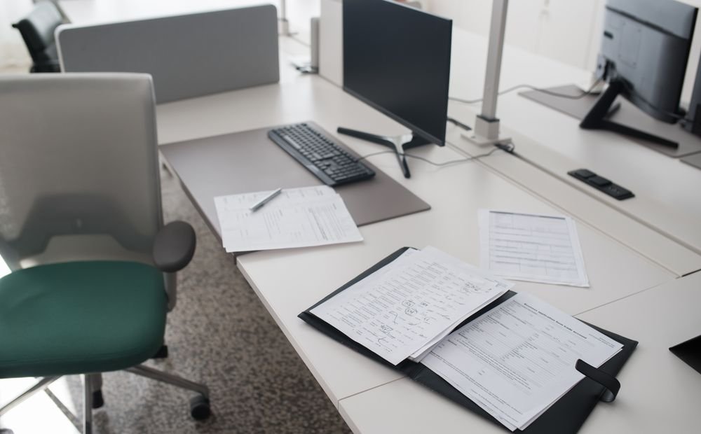 Stack of business documents representing directory citation records to audit Stack of business documents representing directory citation records to audit
